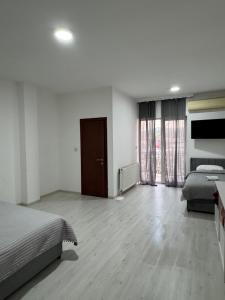 Ένα ή περισσότερα κρεβάτια σε δωμάτιο στο Hotel Palma