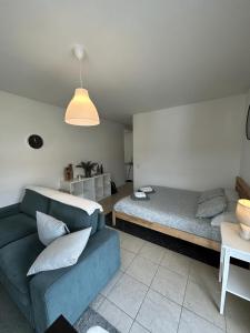 a living room with two beds and a couch at Free Parking - Near the Lake - Lugano apartment in Paradiso