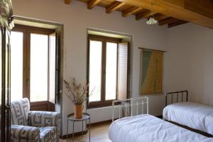 Ένα ή περισσότερα κρεβάτια σε δωμάτιο στο Casa Mourís - entre naturaleza y mar