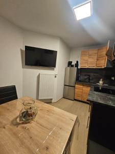 a kitchen with a wooden counter top in a room at Apartment Rückertstraße in Nordhausen