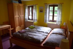 Ein Bett oder Betten in einem Zimmer der Unterkunft Penzion Ida