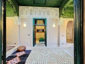Postel nebo postele na pokoji v ubytování riad kasbah privilège and spa
