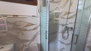 a bathroom with a shower and a sink at Apartamento Liz in Tías +22 photos