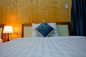 Postel nebo postele na pokoji v ubytování Bungalow Ven Sông