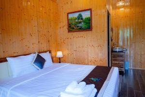 Postel nebo postele na pokoji v ubytování Bungalow Ven Sông