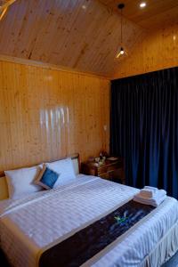 Postel nebo postele na pokoji v ubytování Bungalow Ven Sông