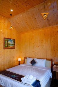 Postel nebo postele na pokoji v ubytování Bungalow Ven Sông