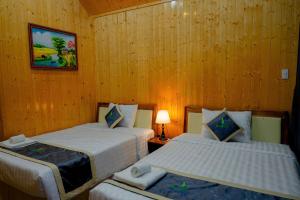 Postel nebo postele na pokoji v ubytování Bungalow Ven Sông