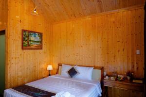 Postel nebo postele na pokoji v ubytování Bungalow Ven Sông