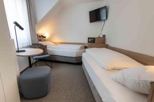 Łóżko lub łóżka w pokoju w obiekcie Hotel Anker
