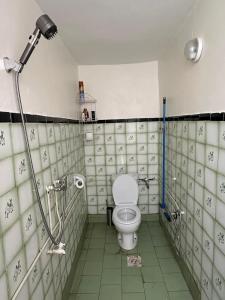 a bathroom with a toilet and a shower at Agréable maison près de la plage in Aglou +24 photos