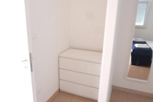A bed or beds in a room at Case al mare in Salento - bilocale B9