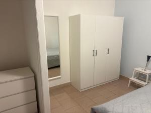 A bed or beds in a room at Case al mare in Salento - bilocale B9