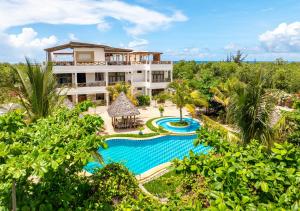 an aerial view of a resort with a swimming pool at Haber Hotel & SPA in Matemwe