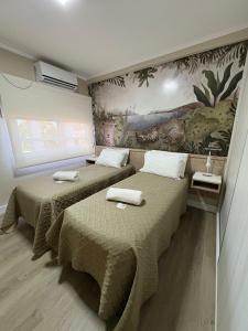 Regia Apartamentos Posadas客房内的一张或多张床位