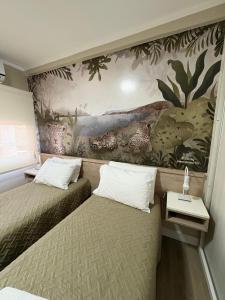Regia Apartamentos Posadas客房内的一张或多张床位