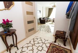 a room with a hallway with a door and a rug at New two bedroomJurmala apartment in Jūrmala