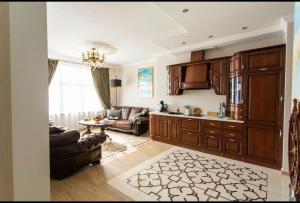 a living room with a couch and a table at New two bedroomJurmala apartment in Jūrmala