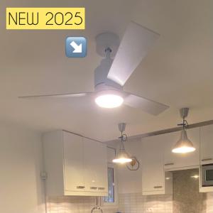 a kitchen with a ceiling fan and lights at Gran sol de la Farella in Llança +12 photos