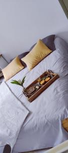 a tray of food on top of a bed at Studio confort montagne in Aulus-les-Bains