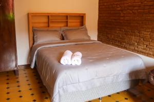 Postel nebo postele na pokoji v ubytování Casa colonial familiar con jardín y piscina en el centro de Asunción - Ideal para grupos