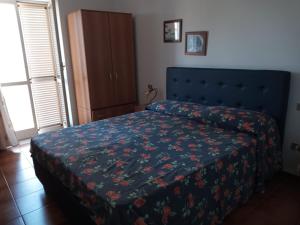Postel nebo postele na pokoji v ubytování B&B Villa Le Palme Scalea