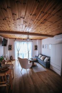 a living room with a couch and a table at Agroturystyka Widokówka Nielisz in Nielisz