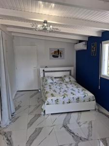 Ένα ή περισσότερα κρεβάτια σε δωμάτιο στο Le Tamarinier Bungalow 2 chambres La Pointe des Châteaux - Anse La Coulée +18 φωτογραφίες