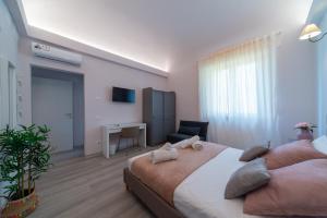 Ένα ή περισσότερα κρεβάτια σε δωμάτιο στο Frida guest house