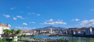 a view of a city with a river and buildings at Cosy in Saint-Jean-de-Luz +2 photos