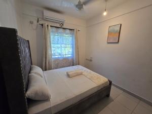 Ένα ή περισσότερα κρεβάτια σε δωμάτιο στο Mannat Homes +6 φωτογραφίες