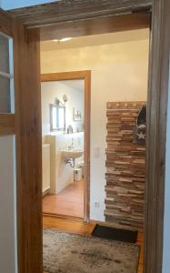 a room with a bathroom with a sink and a mirror at Altstadt Ferienwohnung in Brandenburg an der Havel +53 photos