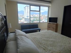 Postel nebo postele na pokoji v ubytování Moderno y cómodo apartamento