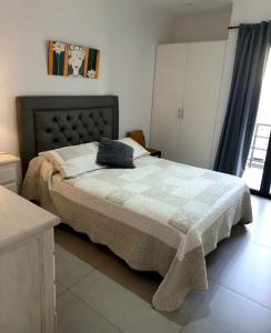 a bedroom with a bed with a pillow on it at El Trébol II in Necochea
