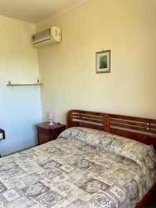 Postel nebo postele na pokoji v ubytování Garden Fiorella