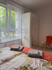 Postel nebo postele na pokoji v ubytování Apartament - jak w domu - 130m2 z Tarasem i ogródkiem