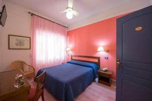 Postel nebo postele na pokoji v ubytování Hotel Sole