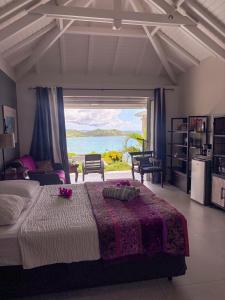 Rúm í herbergi á Carribbean Hill - Stunning View and infinity pool