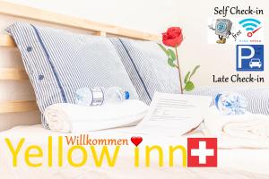 a poster for a yellow inn with towels on a shelf at YELLOW INN - SIMPLE ROOMS -- OLMA Messen & Autobahn 1 Min, HSG 6 Min, Spital 7min, günstige Parkplätze in St. Gallen