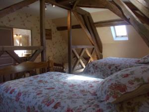 Postel nebo postele na pokoji v ubytování Auberge du Morvan
