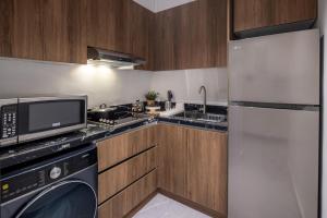 Kuchyň nebo kuchyňský kout v ubytování Delmar Luxury 3BR Apartment 2