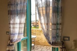 A bed or beds in a room at Corte Del Campanaro
