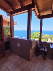 a balcony with a view of the ocean at Casa Tiemme Vista Mare in Costa Paradiso