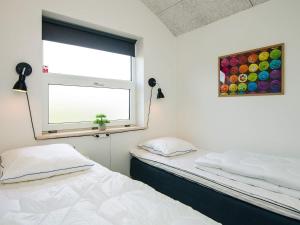 En eller flere senge i et værelse på 4 star holiday home in Børkop