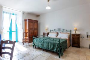 A bed or beds in a room at Corte Del Campanaro