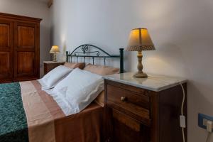 A bed or beds in a room at Corte Del Campanaro