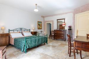 A bed or beds in a room at Corte Del Campanaro
