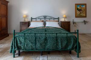 A bed or beds in a room at Corte Del Campanaro