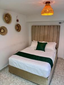 Postel nebo postele na pokoji v ubytování CASA EN PRADO CON PATIO Y QUIOSCo