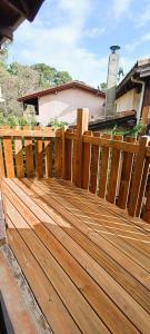 a wooden deck in front of a house at Logement à deux pas du lac Carcans Maubuisson in Carcans
